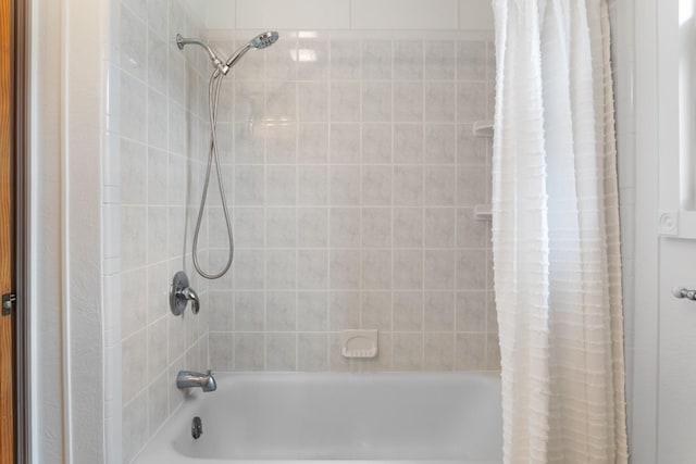 full bath featuring shower / bath combo with shower curtain