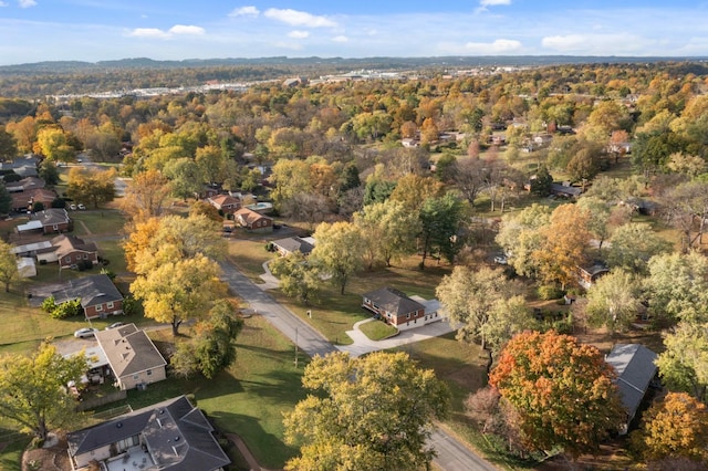 birds eye view of property with a wooded view