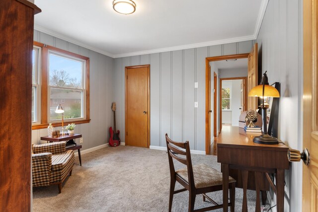 home office with carpet floors, ornamental molding, and baseboards