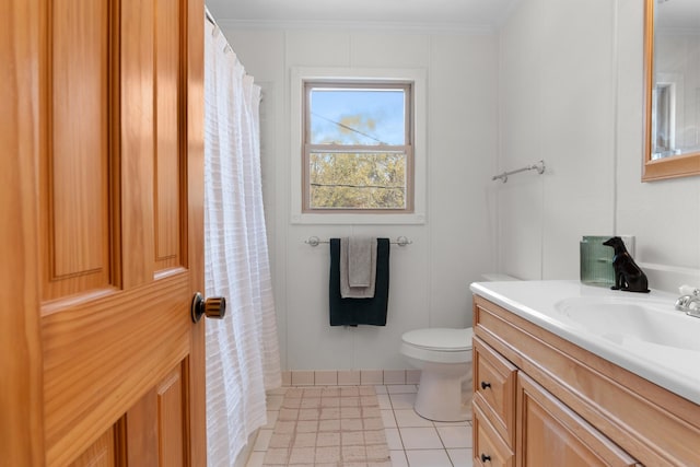 bathroom featuring ornamental molding, vanity, and toilet