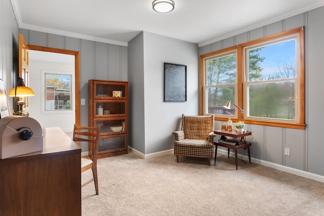 living area featuring baseboards, ornamental molding, a wealth of natural light, and light colored carpet