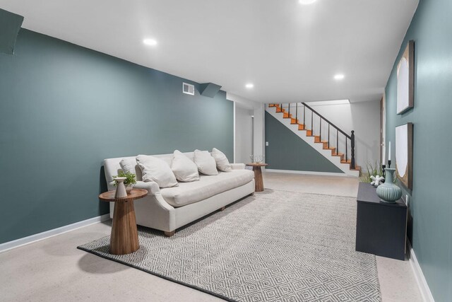 living room with stairs, recessed lighting, visible vents, and baseboards