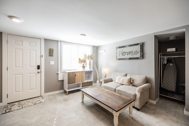 living room with light carpet and baseboards