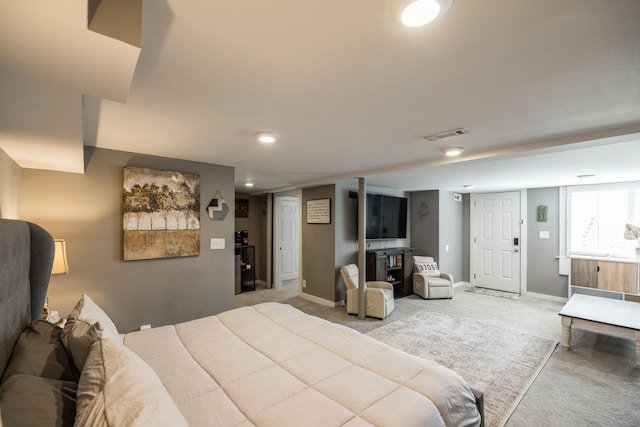 bedroom featuring light carpet, baseboards, and visible vents