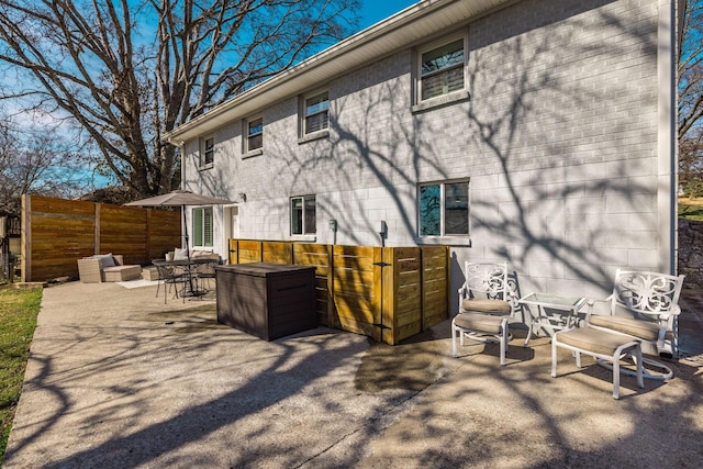 back of house featuring fence and a patio