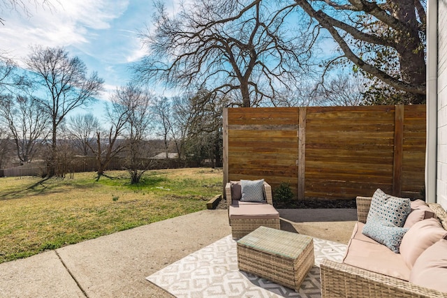 view of patio featuring fence and an outdoor hangout area