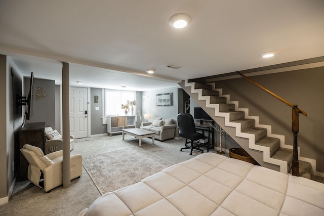 carpeted living room with stairs, visible vents, and baseboards