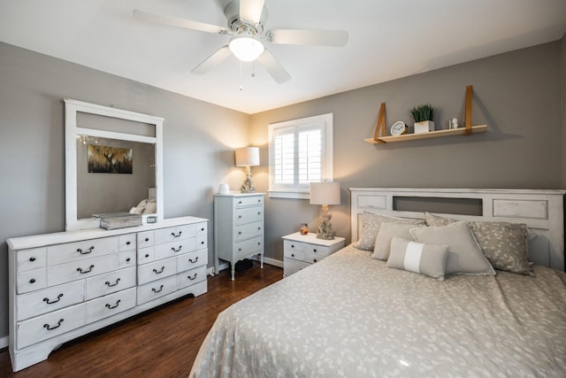 bedroom with dark wood-style flooring and a ceiling fan