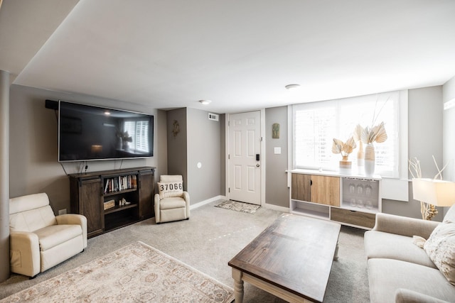 living room with light colored carpet and baseboards