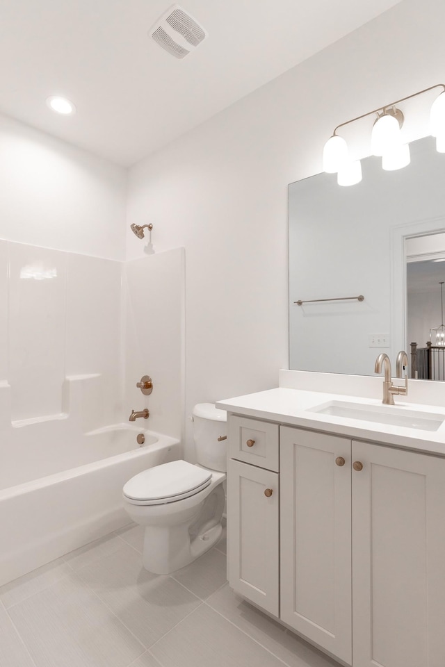 bathroom featuring visible vents, toilet, tile patterned flooring, vanity, and shower / washtub combination