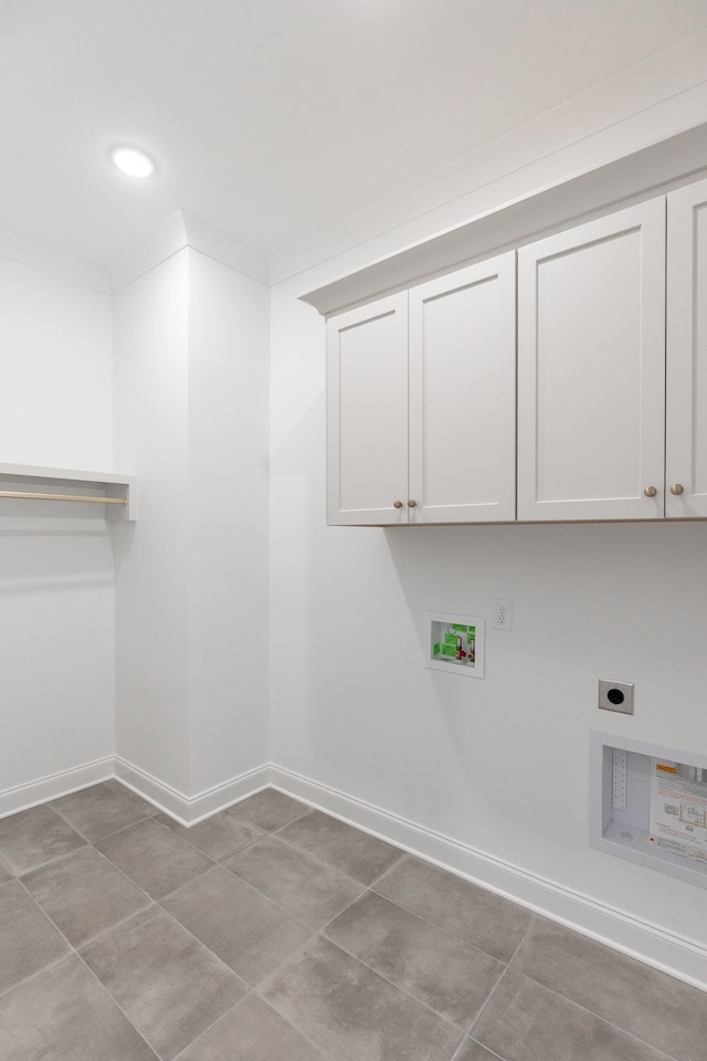 laundry room featuring hookup for a washing machine, hookup for an electric dryer, cabinet space, and baseboards