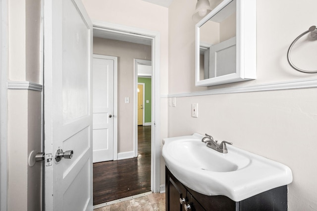 bathroom with vanity and baseboards