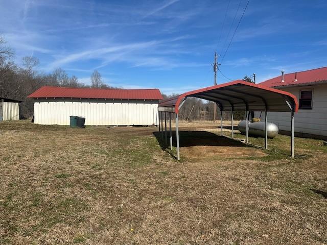 view of yard featuring a carport