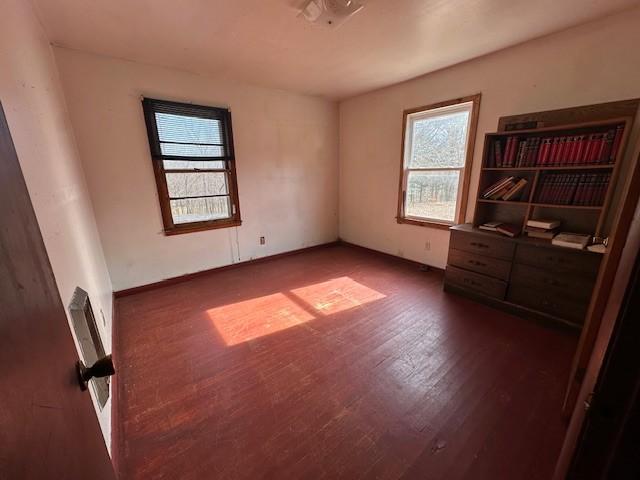 empty room with dark wood-style floors