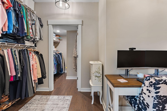 office space with dark wood finished floors and baseboards