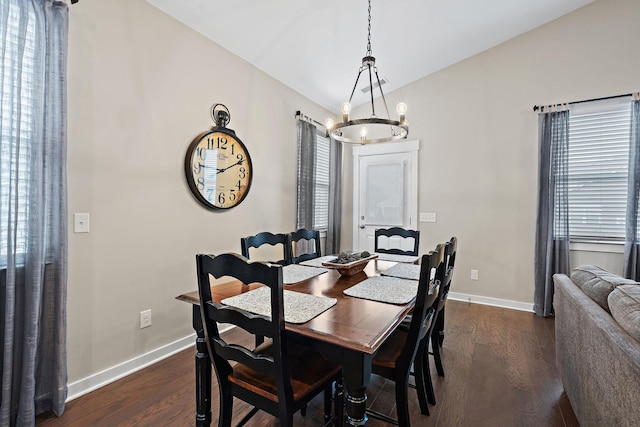 dining area featuring plenty of natural light, baseboards, and dark wood finished floors