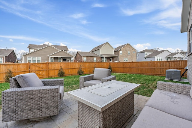 view of patio with a fenced backyard, a residential view, and cooling unit