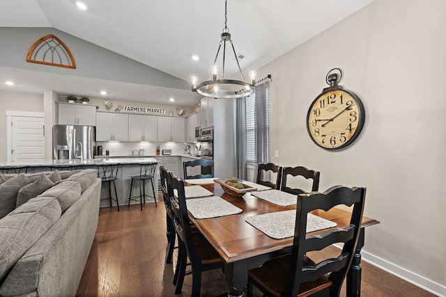 dining space with vaulted ceiling, recessed lighting, dark wood finished floors, and baseboards