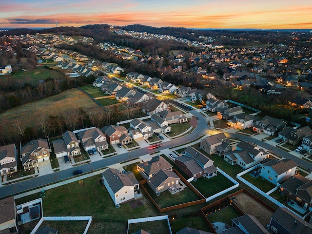 aerial view at dusk with a residential view