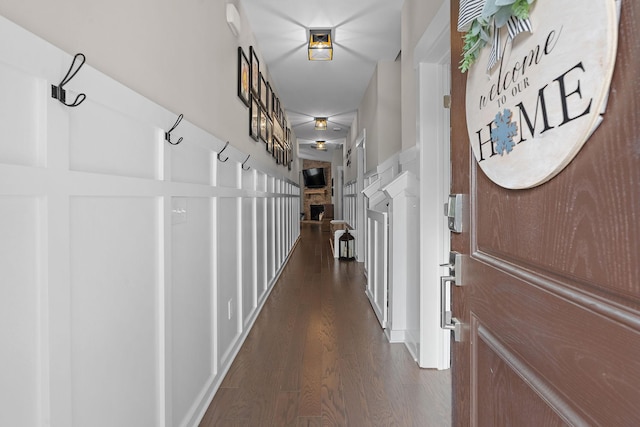 corridor with dark wood-style flooring