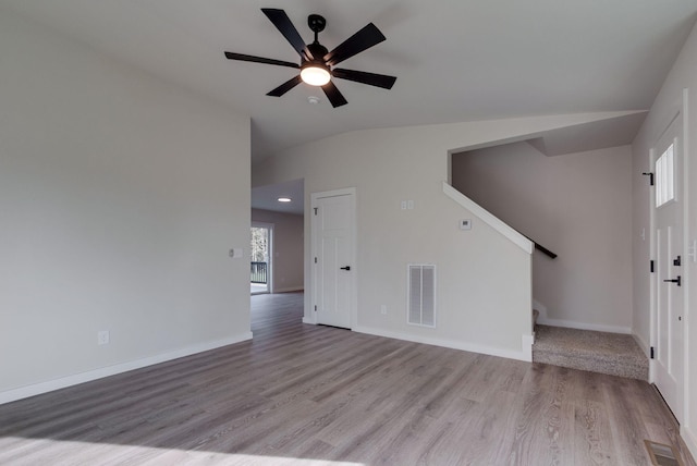 unfurnished living room featuring light wood-style floors, baseboards, and visible vents