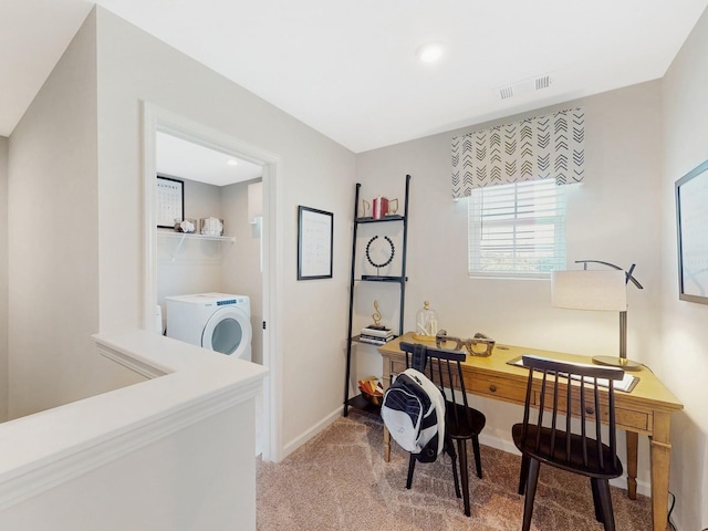 office space featuring light colored carpet, washer / clothes dryer, visible vents, and baseboards