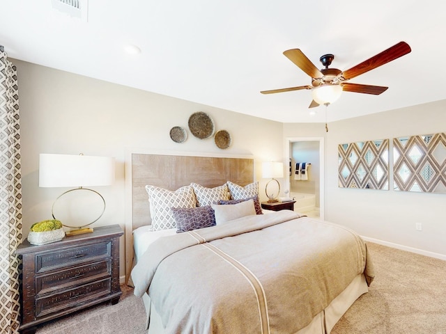 carpeted bedroom featuring ceiling fan, visible vents, and baseboards