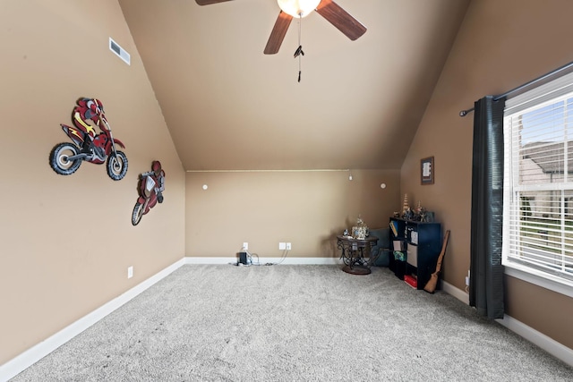 additional living space featuring a wealth of natural light, carpet flooring, vaulted ceiling, and baseboards