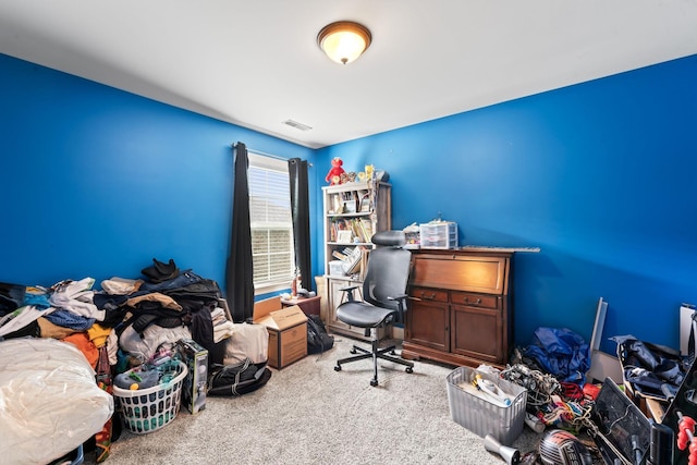 office with visible vents and light colored carpet