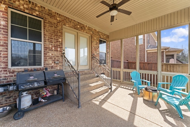 view of patio / terrace with entry steps, grilling area, and a ceiling fan