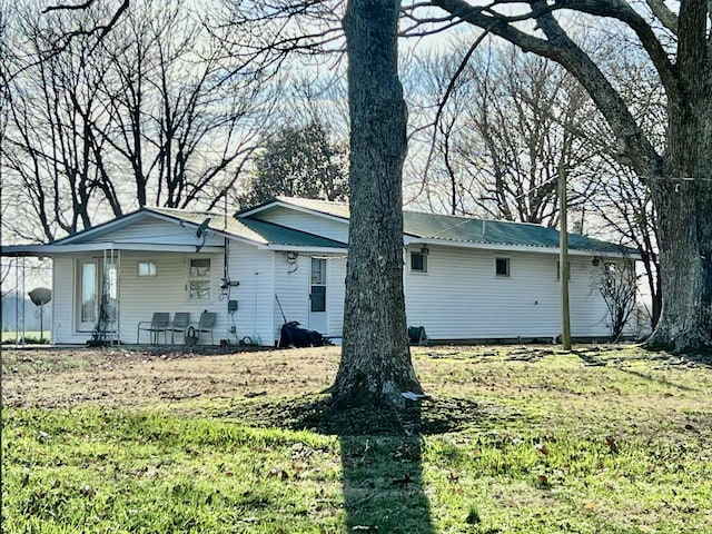 exterior space with a yard and a porch