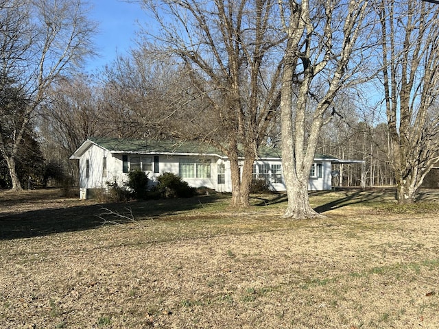 exterior space with a front lawn