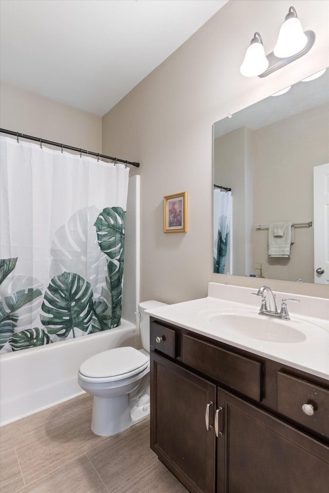 bathroom featuring shower / bathtub combination with curtain, vanity, and toilet