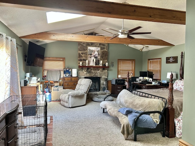 bedroom with a stone fireplace, lofted ceiling with beams, carpet floors, and a textured ceiling