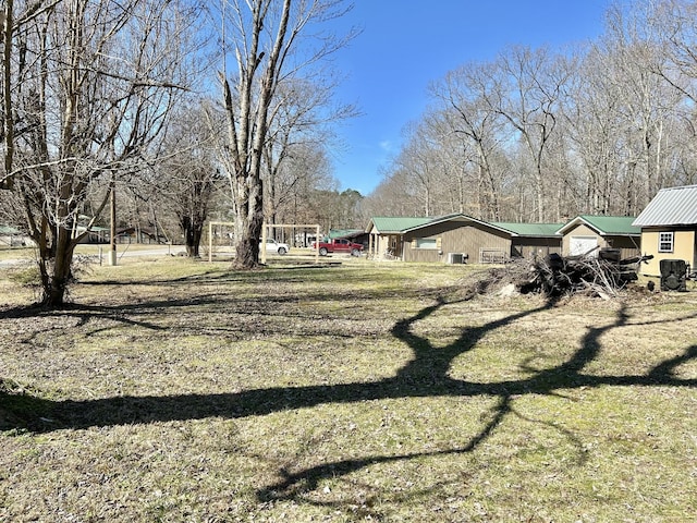 view of property exterior with a yard