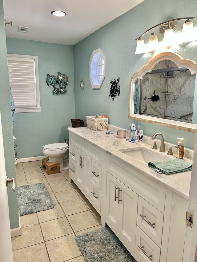 bathroom featuring visible vents, toilet, a stall shower, tile patterned floors, and vanity