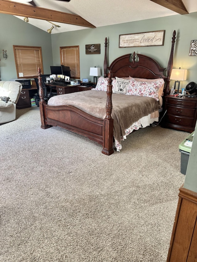 bedroom with vaulted ceiling with beams, carpet floors, and a textured ceiling