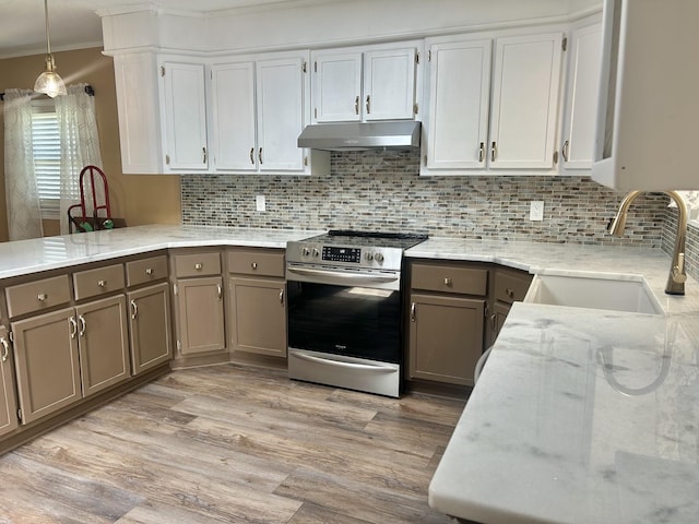 403 Bryan Blvd, Manchester, TN 37355 - kitchen featuring stainless steel electric range oven, under cabinet range hood, a sink, light stone counters, and light wood-style flooring