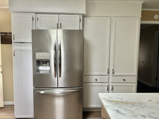 403 Bryan Blvd, Manchester, TN 37355 - kitchen with stainless steel refrigerator with ice dispenser, white cabinets, wood finished floors, crown molding, and light stone countertops