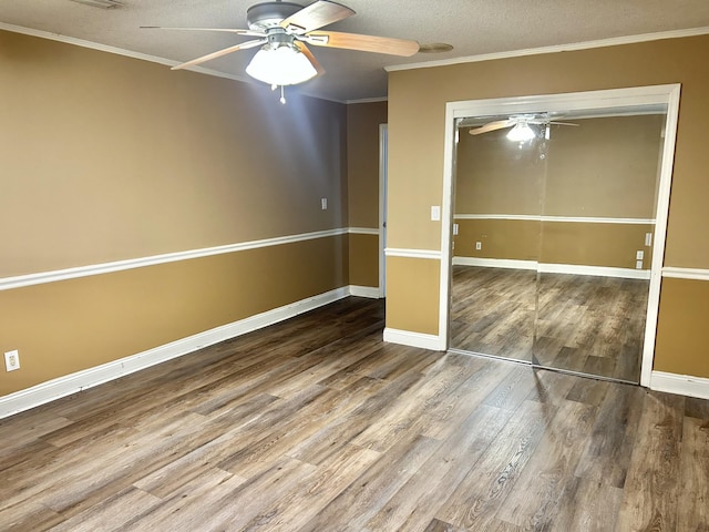 403 Bryan Blvd, Manchester, TN 37355 - unfurnished bedroom featuring wood finished floors, a closet, a textured ceiling, baseboards, and ornamental molding