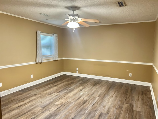 403 Bryan Blvd, Manchester, TN 37355 - empty room with wood finished floors, a textured ceiling, a ceiling fan, ornamental molding, and baseboards