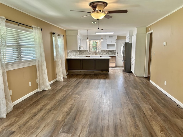 403 Bryan Blvd, Manchester, TN 37355 - kitchen with ceiling fan, freestanding refrigerator, a peninsula, light countertops, and a sink