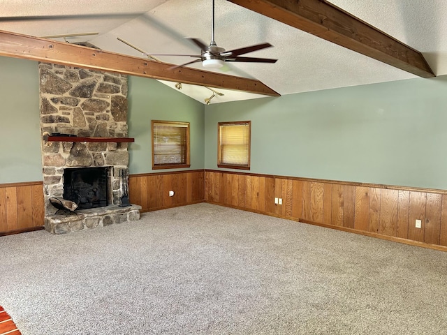 403 Bryan Blvd, Manchester, TN 37355 - unfurnished living room featuring wainscoting, a ceiling fan, a fireplace, carpet, and wooden walls