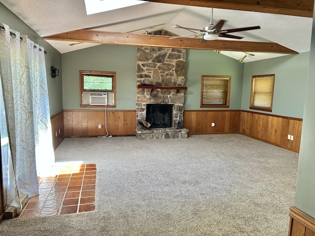 403 Bryan Blvd, Manchester, TN 37355 - unfurnished living room with a wainscoted wall, a skylight, a fireplace, wood walls, and cooling unit