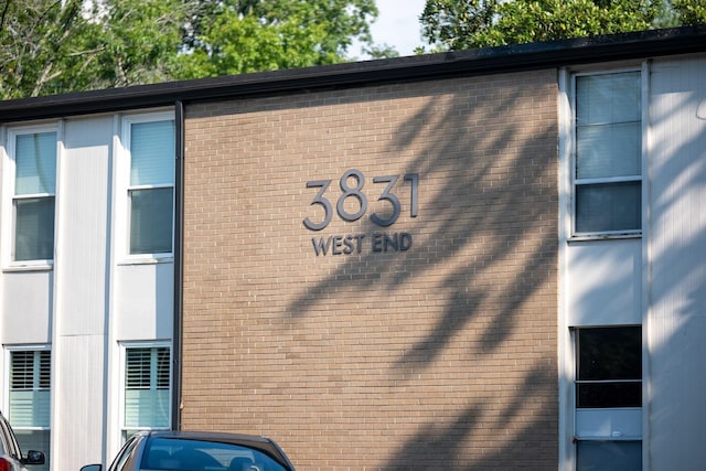 view of side of property featuring brick siding