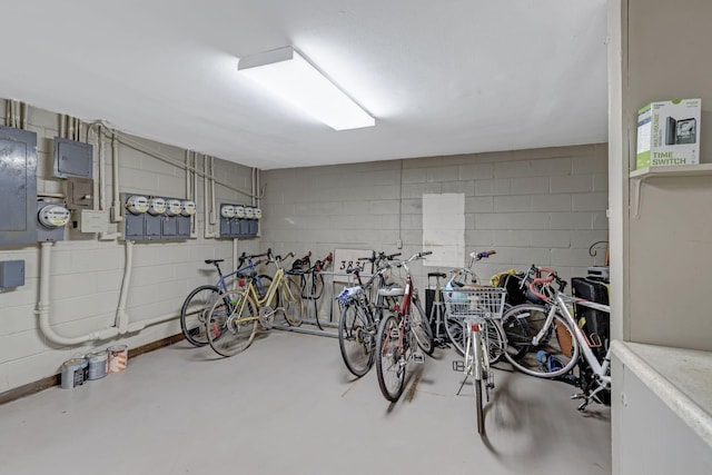 garage with concrete block wall and bike storage