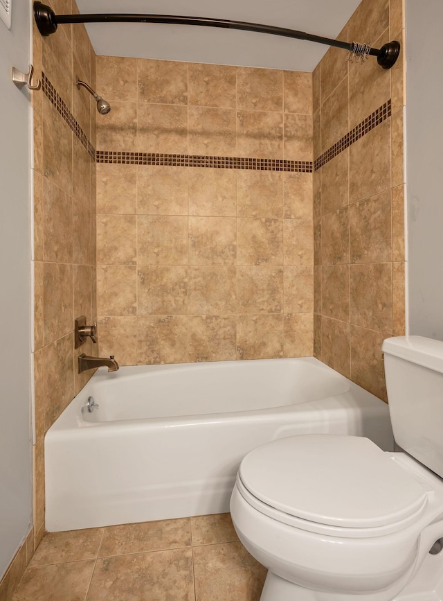 full bath with bathtub / shower combination, toilet, and tile patterned floors