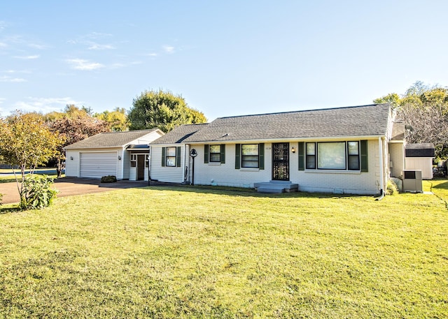 ranch-style home featuring an attached garage, a front yard, and brick siding