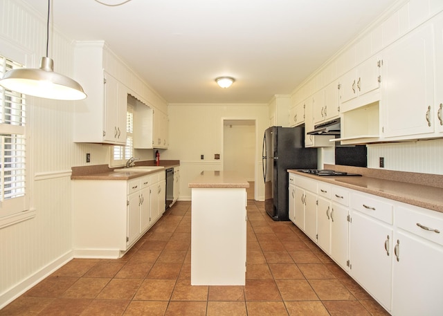 kitchen with a center island, under cabinet range hood, black appliances, white cabinetry, and light tile patterned flooring