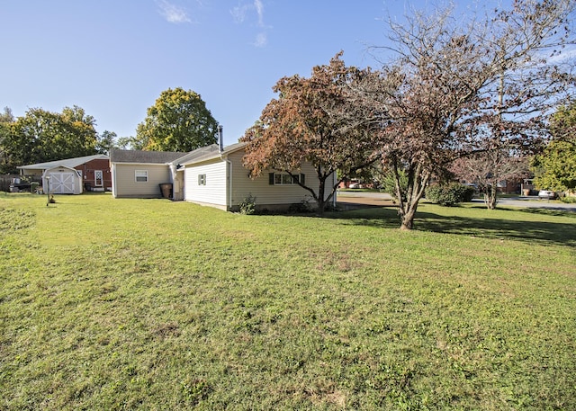 view of yard with a storage unit and an outbuilding